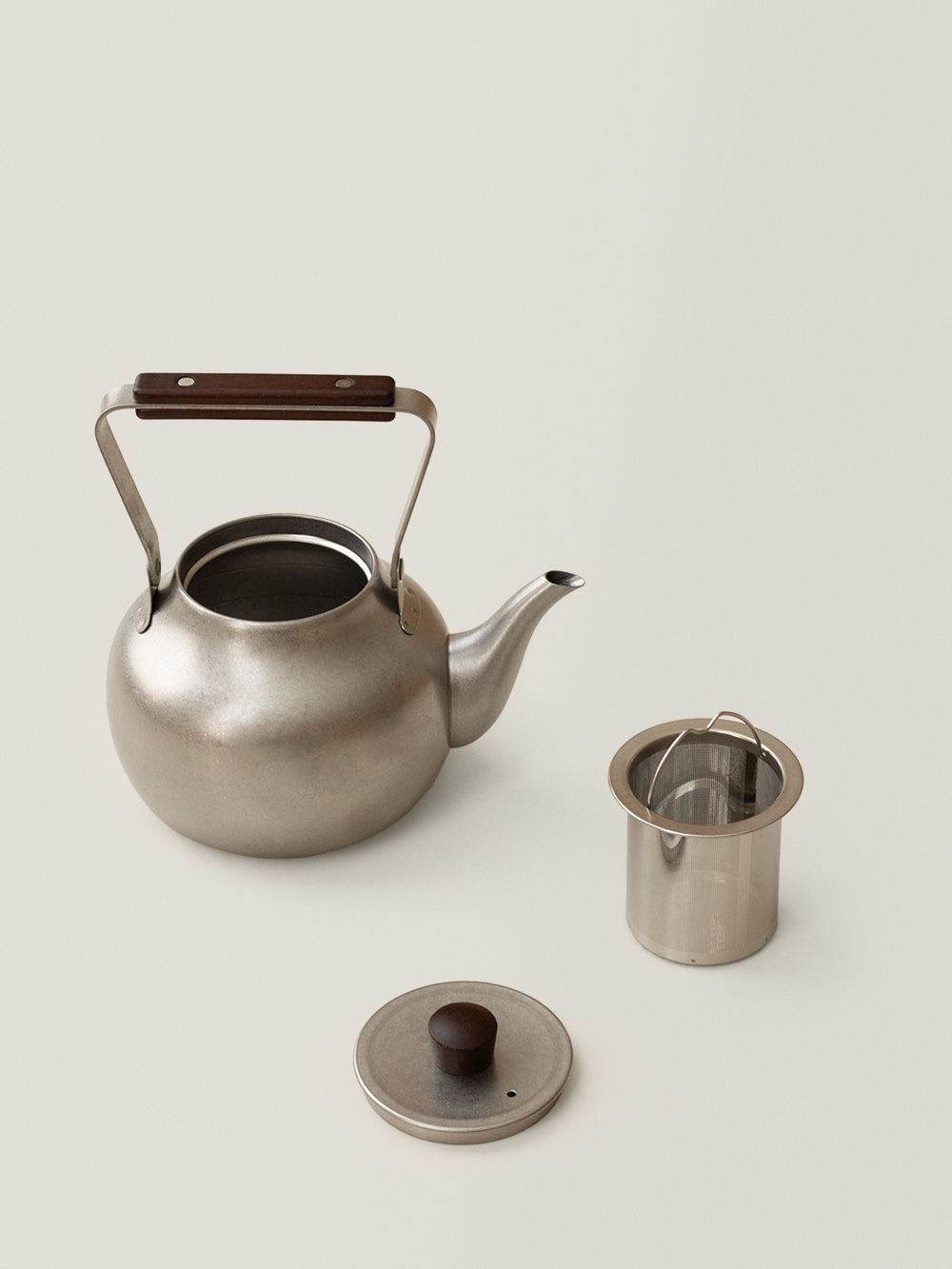 Suno stainless steel kettle with wooden handle, lid and separate cylindrical tea filter