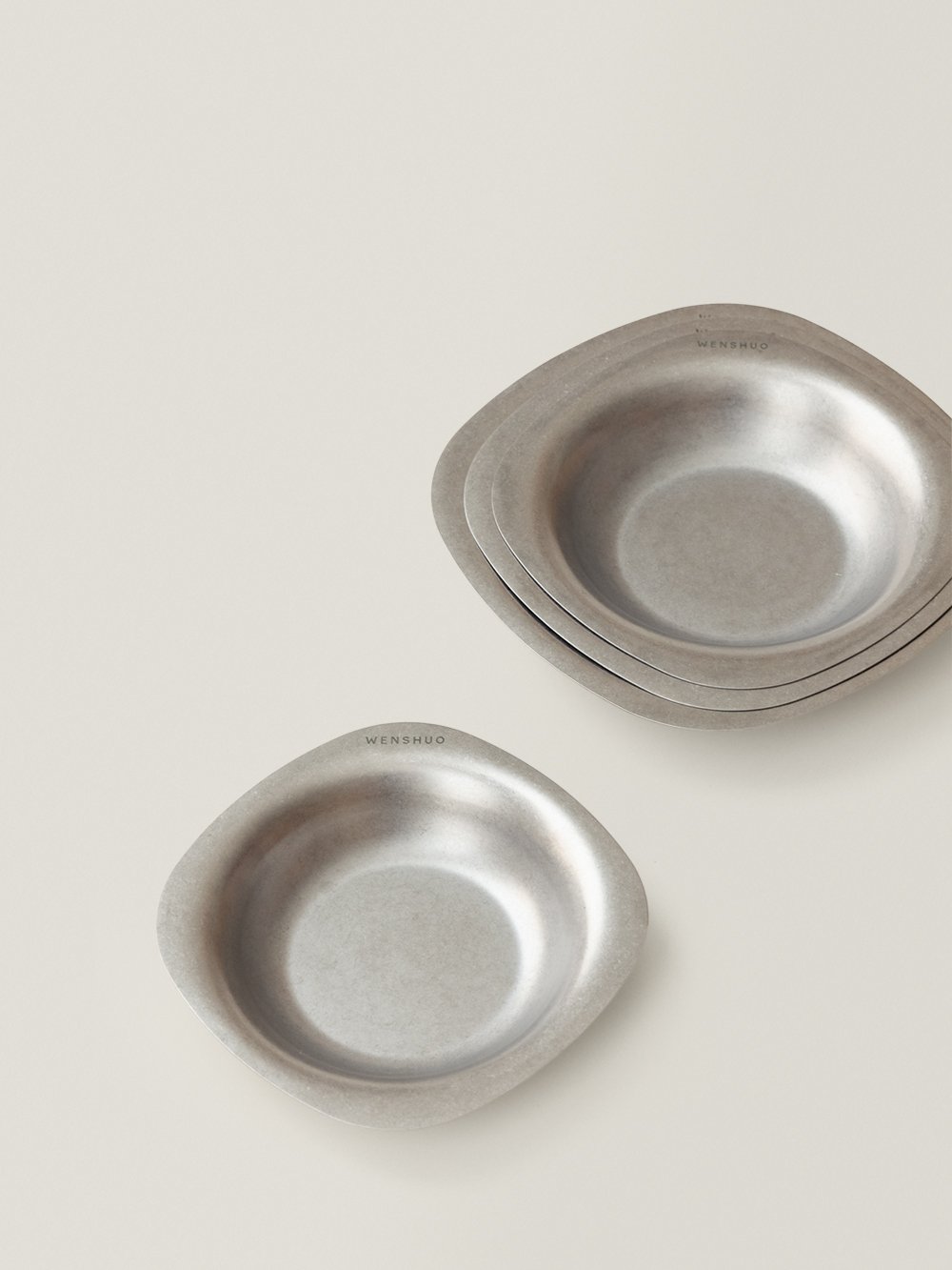 ELOA bowls stacked, showing the soft-square rim and engraved WENSHUO mark