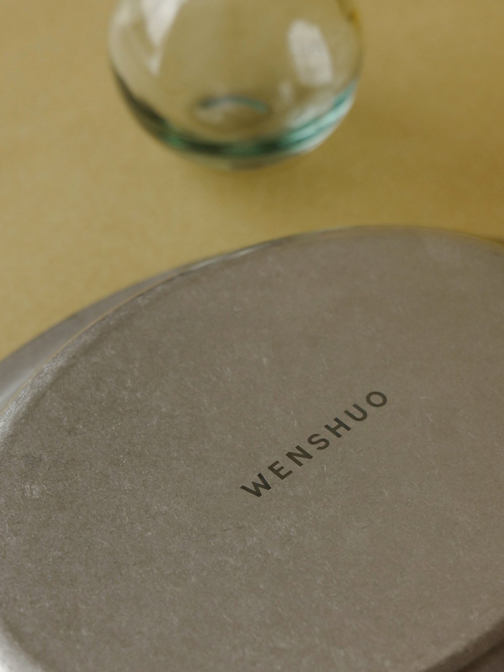Close-up of the engraved WENSHUO mark on the Ova plate
