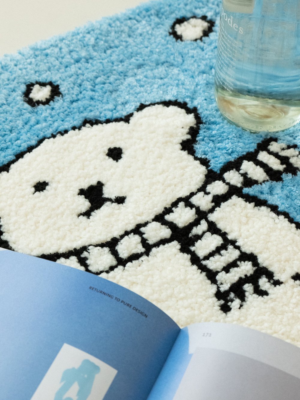 Milo Snow Bear Tufted Rug - styled view