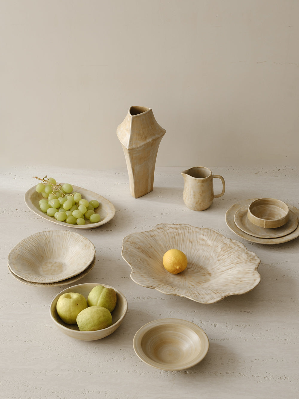 A table set with WENSHUO ceramic plates and bowls