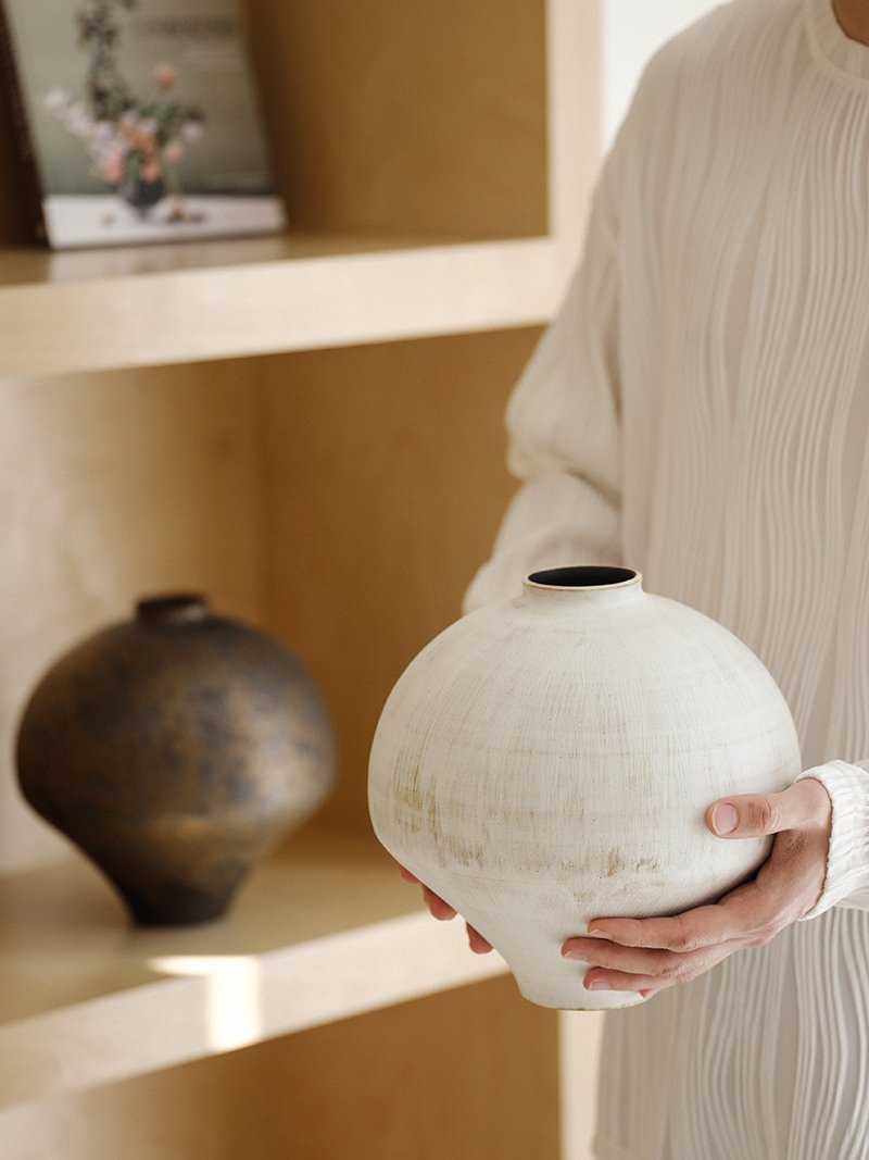 Earthbrush Ceramic Vase — held lifestyle view