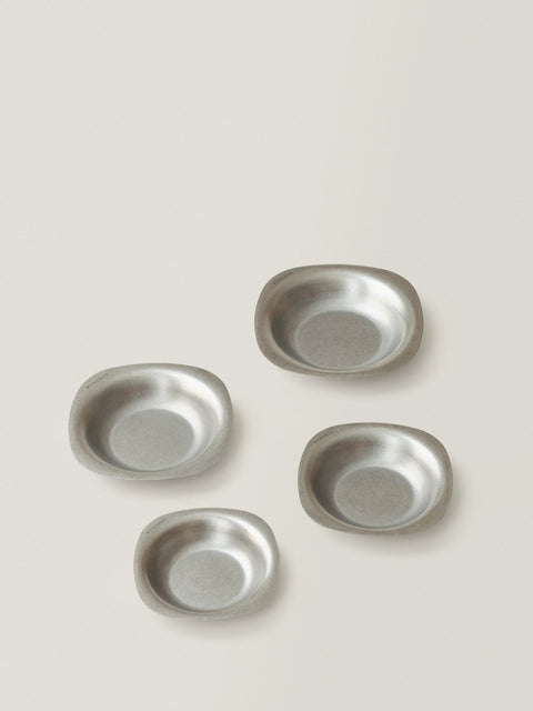 ELOA soft-square stainless steel bowls in four sizes on a warm grey background