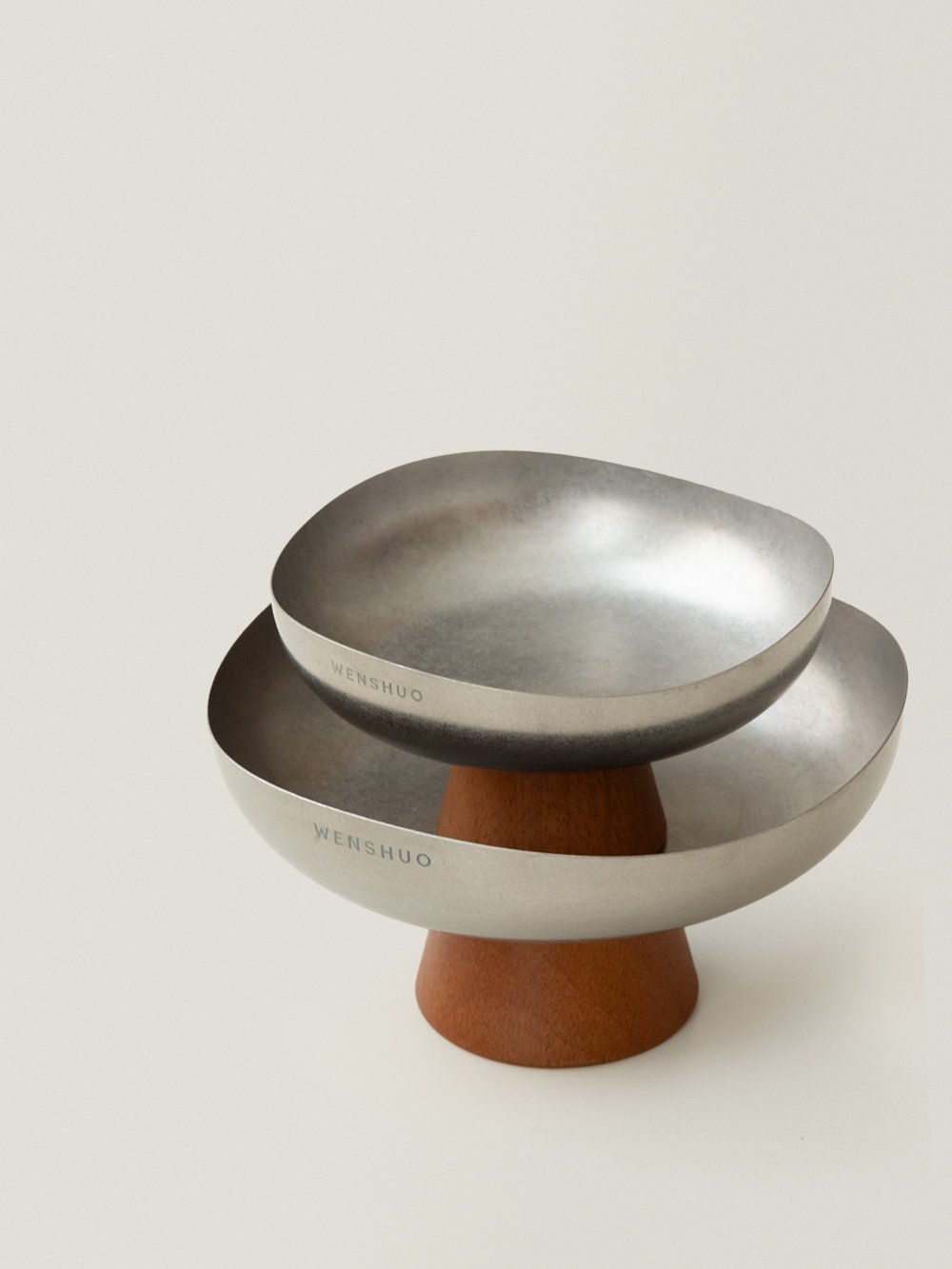 Small Forma bowl resting inside the large one as a two-tier display